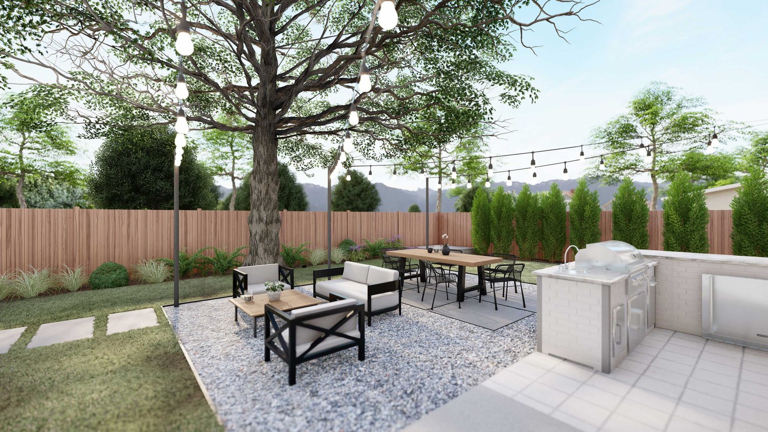 Twin Falls backyard view from kitchen area to gravel patio seating and dining area with string lights, plants and wooden fence